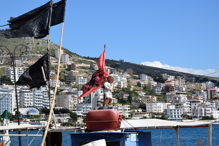 Albanian tradition - toys hanging on the boat for brings happiness. Saranda, Albaniaの写真素材