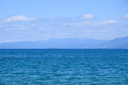 Landscape of Ohrid lake with mountain background. Pogradec, Tushemisht, Albania.の写真素材