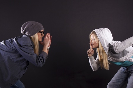 Modern dance, hip hop girl dancer on a black background.