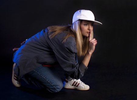 Modern dance, hip hop girl dancer on a black background.の写真素材