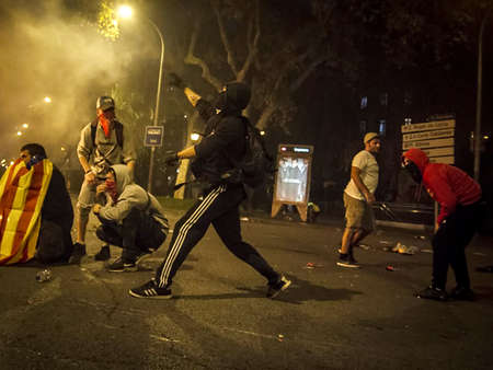 Riots between the Spanish police and the Catalan people in the Urquinaona square of Catalonia, in...