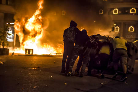 Riots between the Spanish police and the Catalan people in the Urquinaona square of Catalonia, in the context of the first of October.のeditorial素材