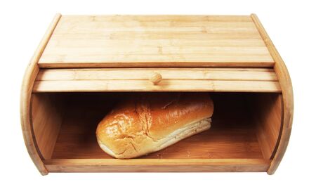 wooden breadbasket with loaf of breas isolated closeupの写真素材