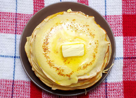 pancackes with butter on the plate closeup