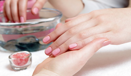 female gentle pink manicure closeupの写真素材