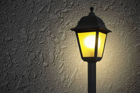 Grey wall background with street light at the frontの写真素材