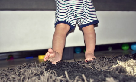 toddler tryes to make first step
