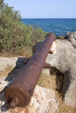 Ancient cannon on lookout tower along the italian coast, Sardiniaの写真素材