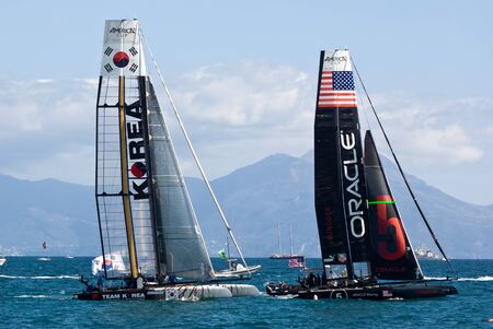 Naples, Italy - April 11-15, 2012 - Oracle Racing and Korea Team catamarans in America Cup World Series in the gulf of the Naplesのeditorial素材