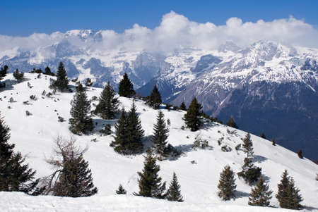 View of an alpine winter landscape from the top of a mountainの写真素材
