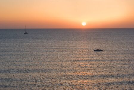 Sunset on the horizon in Sicily, Italyの写真素材