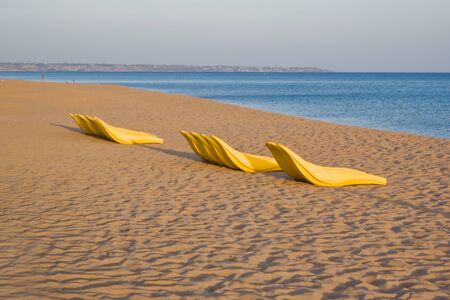 Beach chairs and rescue boatの写真素材