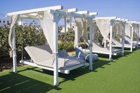 Relax area of a resort with canopy beds
