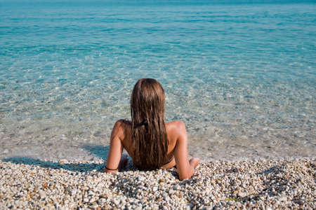 Vie of a girl on the shoreline, Tyrrhenian seaの写真素材