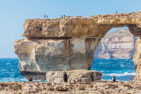 Rough seas at Azure Window in Gozo, Malta. The Azure Window, also known as the Dwejra Window, was a 28-metre-tall (92 ft) natural arch on the island of Gozo in Malta. It collapsed in storm on Mar 2017の写真素材