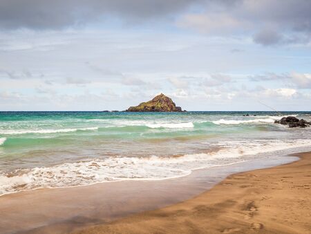 Koki Beach Park Maui. The dark red sand at Koki Beach was produced by the nearby cinder cone hill of Ka Iwi O Pele. Koki Beach is one of two famous Hana surf breaks and favorite spot for local surfersの写真素材