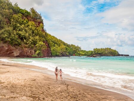 Koki Beach Park Maui. The dark red sand at Koki Beach was produced by the nearby cinder cone hill of Ka Iwi O Pele. Koki Beach is one of two famous Hana surf breaks and favorite spot for local surfersの写真素材
