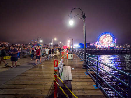 Santa Monica - Aug 2019: The Santa Monica Pier at night (Yacht Harbor, Sport Fishing Boating, Cafes), Los Angeles California.のeditorial素材
