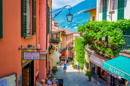 Bellagio borgo on Lake Como, Italy - 2021 Jun: Alley and stores, the town is famous for popular luxury resort, coast and lakefront.のeditorial素材