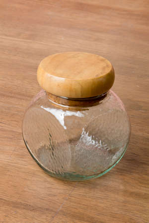 glass jar on wood tableの写真素材
