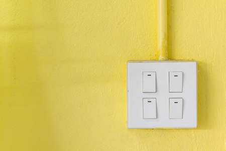 light switches yellow wallの写真素材