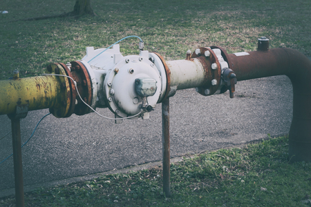 old rusty pipe old metal pipe with valveの写真素材