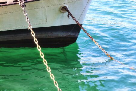 ship and anchor chains on the coast 