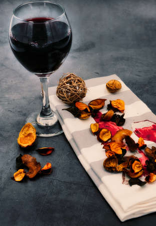 Wine on a white background and some flowersの写真素材