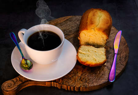 Very hot cup of coffee with breadの写真素材