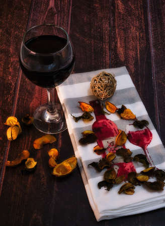 Wine on a white background and some flowersの写真素材