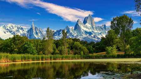 A body of water with a mountain in the backgroundの写真素材