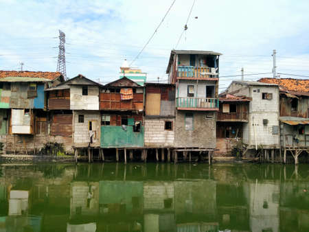 Roxy, Jakarta, Indonesia - April 6, 2020: housing on the edge of slumsのeditorial素材