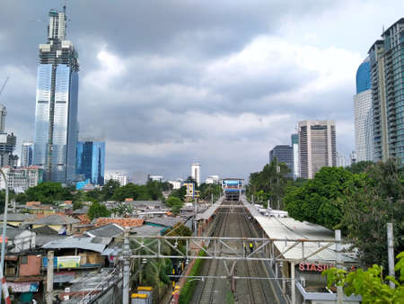 Jakarta - April 3 2020: The view of the train from above. around the office building looksのeditorial素材