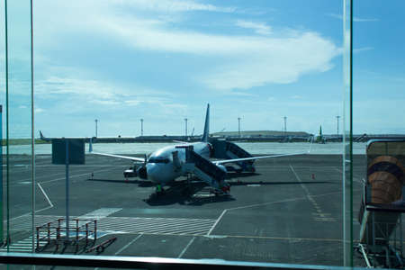 Bandar udara Ngurah Rai, Bali, Indonesia - December 4, 2018 : The atmosphere of the airport was seen by airplanes that were parkedのeditorial素材