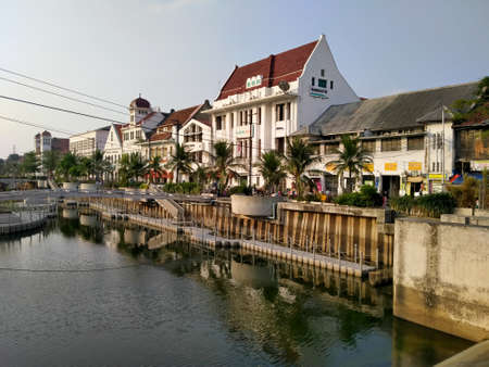 Kota tua, Jakarta, Indonesia - (06-10-2021) : Dirty black river atmosphere against the background of the historical museum building in the old city tourist areaのeditorial素材