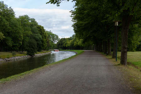 A view of a small canal in the middle of the park.