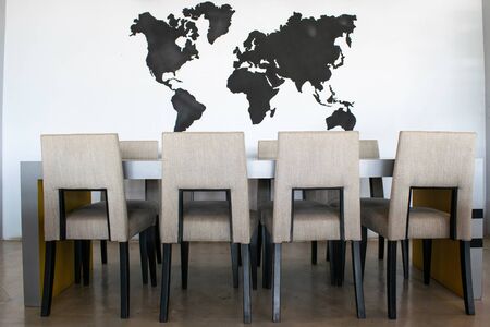 modern dining room interior World map background.の写真素材