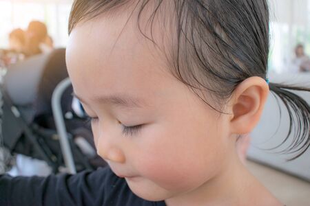 Portrait of a pretty little baby asia girlの写真素材