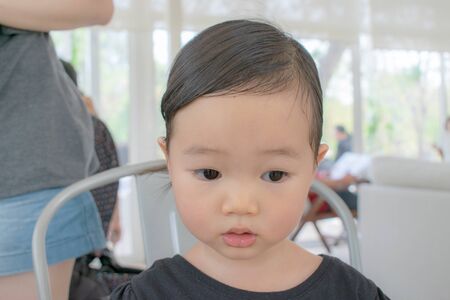 Portrait of a pretty little baby asia girlの写真素材