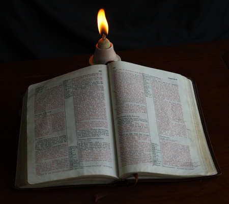 Bible under oil lampの写真素材