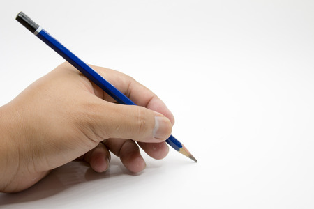 Men's hand is writing notes.の写真素材