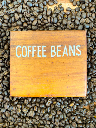 Coffee beans top view with a nameplate in the middleの写真素材