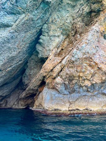 Chenoua cave against turquoise sea in Tipaza, Algeriaの写真素材