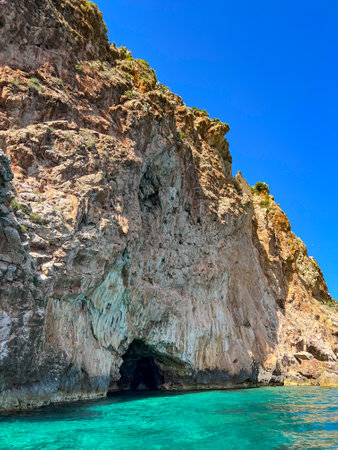 Chenoua cave against turquoise sea in Tipaza, Algeria