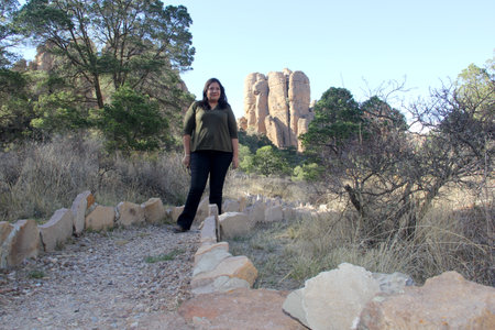 Latin adult woman explores the desert area of Sierra de Organos with large rock formations in Zacatecas Mexicoの写真素材