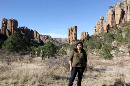 Latin adult woman explores the desert area of Sierra de Organos with large rock formations in Zacatecas Mexicoの写真素材