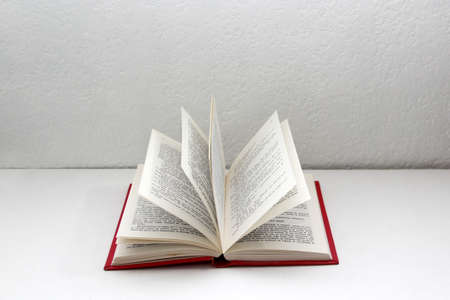 Reading time with an open book ready to be read in the solitude of a room with glasses and coffee to...