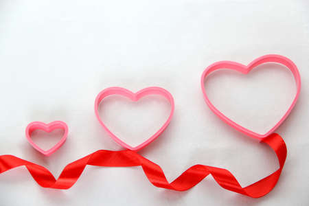 teddy bear, box of chocolates and pink hearts with ribbon on white background, Valentine's Day gifts, advertising bannerの写真素材