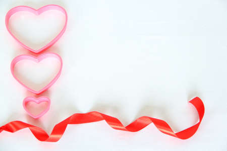 teddy bear, box of chocolates and pink hearts with ribbon on white background, Valentine's Day gifts, advertising bannerの写真素材