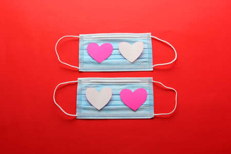 valentine in pandemic by covid-19, protection mask clinical use and hearts